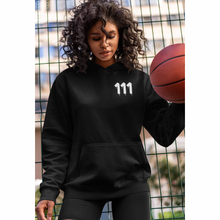 Load image into Gallery viewer, Black hoodie with 111 Angel Number design from Angel Numbers Merch Official, symbolizing new beginnings & manifestation.