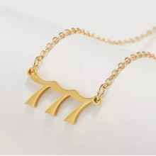 Load image into Gallery viewer,  Gold 777 Angel Number Necklace from Angel Numbers Merch Official, symbolizing luck, divine knowledge, and spiritual awakening.
