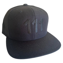 Load image into Gallery viewer,  Black hat featuring  black embroidered 111 Angel Number from Angel Numbers Merch Official. Symbolizes new beginnings &amp; alignment.
