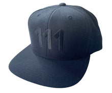 Load image into Gallery viewer,  Black hat featuring  black embroidered 111 Angel Number from Angel Numbers Merch Official. Symbolizes new beginnings &amp; alignment.
