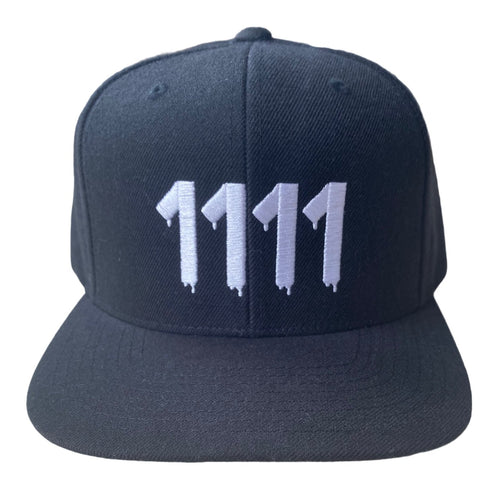  1111 Angel Number Hat  Black/White from Angel Numbers Merch Official, representing synchronicity & manifestation.
