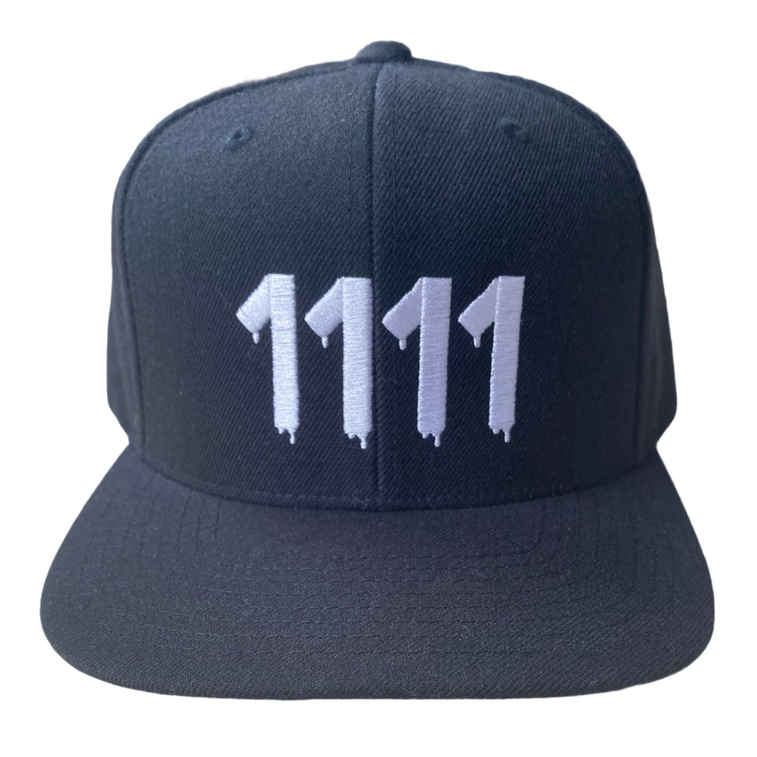  1111 Angel Number Hat  Black/White from Angel Numbers Merch Official, representing synchronicity & manifestation.
